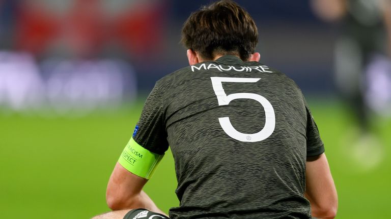 Harry Maguire looks dejected after Manchester United's defeat to RB Leipzig in the Champions League