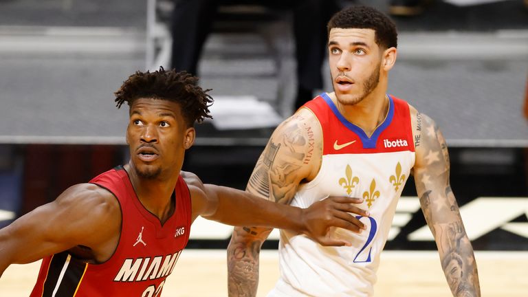 Jimmy Butler #22 of the Miami Heat defends Lonzo Ball #2 of the New Orleans Pelicans during the second quarter at American Airlines Arena on December 25, 2020
