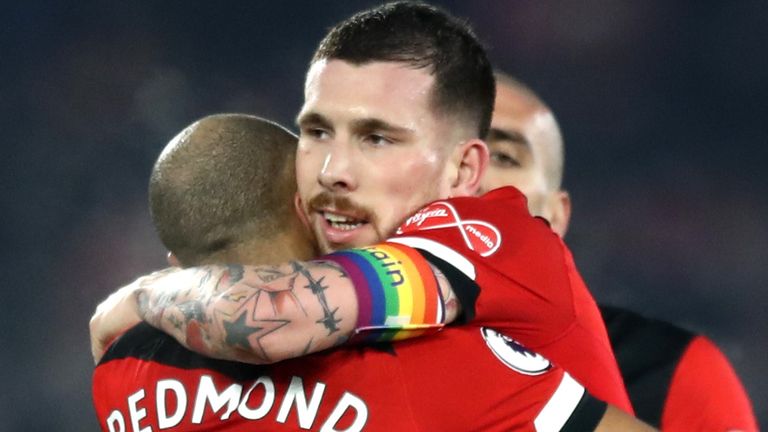 SOUTHAMPTON, ENGLAND - DECEMBER 04: Pierre-Emile Hojbjerg of Southampton celebrates with teammate Nathan Redmond at full-time after the Premier League match between Southampton FC and Norwich City at St Mary's Stadium on December 04, 2019 in Southampton, United Kingdom. (Photo by Bryn Lennon/Getty Images)
