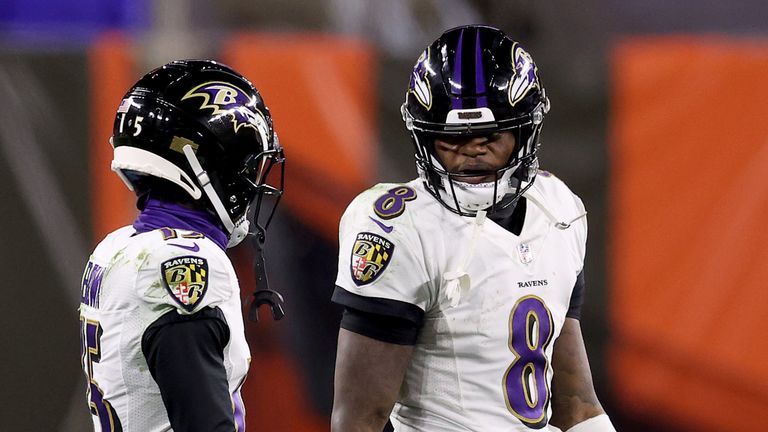Lamar Jackson of the Baltimore Ravens speaks with Marquise Brown during the fourth quarter in the game against the Cleveland Browns