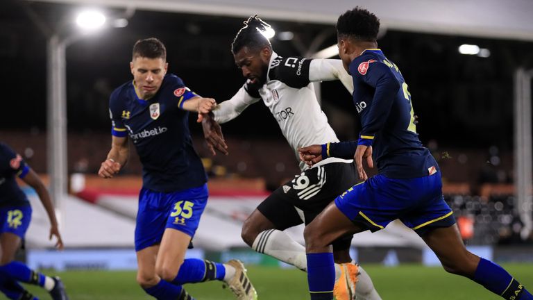 Saints defender Jan Bednarek squeezes Andre-Frank Anguissa off the ball