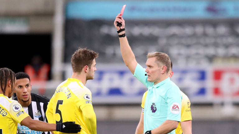 Joachim Andersen of Fulham is sent off by referee Graham Scott at Newcastle