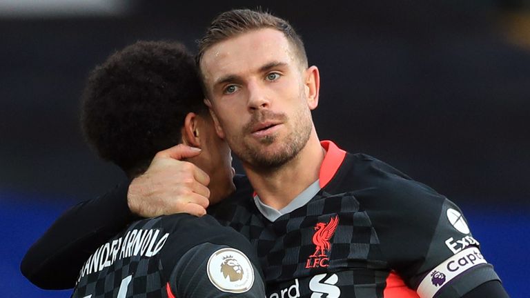 Jordan Henderson celebrates with Trent Alexander-Arnold after putting Liverpool four-up at Palace