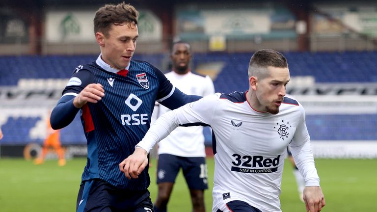 Ross County's Jordan Tillson and Rangers' Ryan Kent battle for the ball