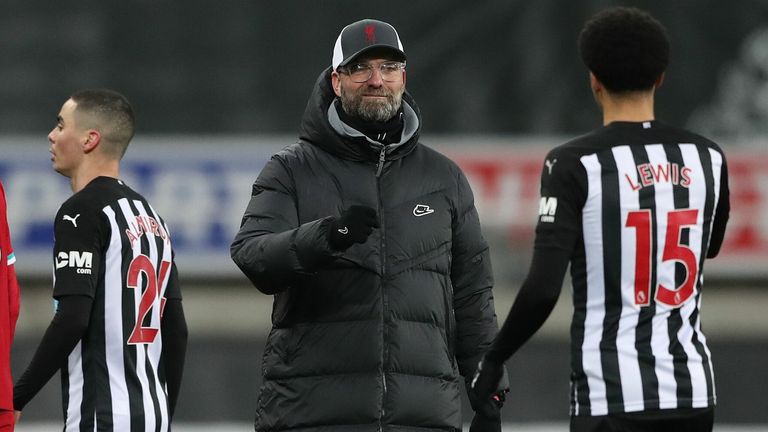 Jurgen Klopp shakes hands with Jamal Lewis following the 0-0 draw