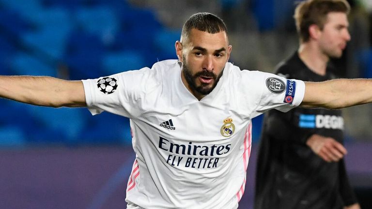 Karim Benzema wheels away in delight after his early goal in Madrid