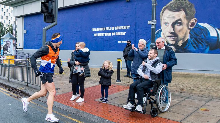 Kevin Sinfield MBE runs to greet Rob Burrow on day 5 of his seven marathons in seven days fundraising challenge.