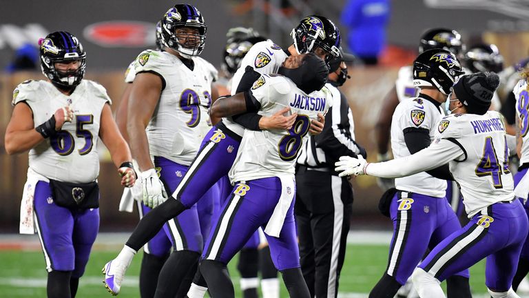 BALTIMORE, MD - OCTOBER 23: Cleveland Browns linebacker Deion Jones (54) is  stiff armed by Baltimore Ravens quarterback Lamar Jackson (8) during the Cleveland  Browns game versus the Baltimore Ravens on October