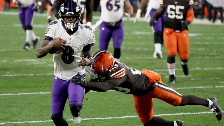  Lamar Jackson of the Baltimore Ravens scores a touchdown during the game against the Cleveland Browns 