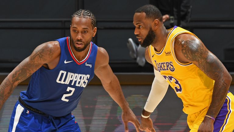  Kawhi Leonard #2 of the LA Clippers and LeBron James #23 of the Los Angeles Lakers stand on the court on December 22, 2020