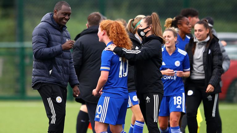 Emile Heskey celebrates victory with Annabel Blanchard during the FA Women's Championship match between Leicester City Women and Liverpool Women