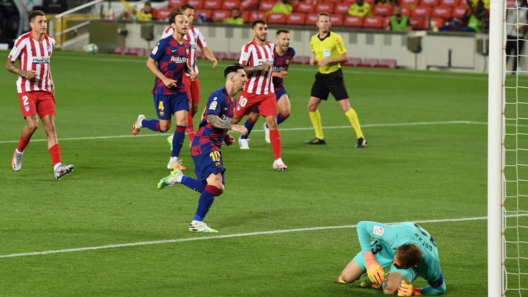 Lionel Messi of FC Barcelona celebrates after scoring his team's second goal by penalty against Goalkeeper Jan Oblak of Atletico Madrid during the Liga match between FC Barcelona and Club Atletico de Madrid at Camp Nou on June 30, 2020 in Barcelona, Spain