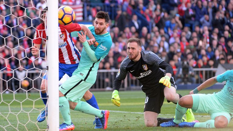 Filipe Luis, #3 of Atletico de Madrid and Lionel Messi, #10 of FC Barcelona and Jan Oblak, #13 of Atletico de Madrid during The La Liga match between Club Atletico de Madrid v FC Barcelona - La Liga at Vicente Calderon on February 26, 2017 in Madrid, Spain.