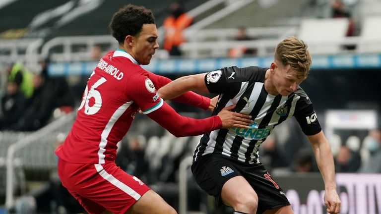 Trent Alexander-Arnold contains Matt Ritchie during a goalless opening period