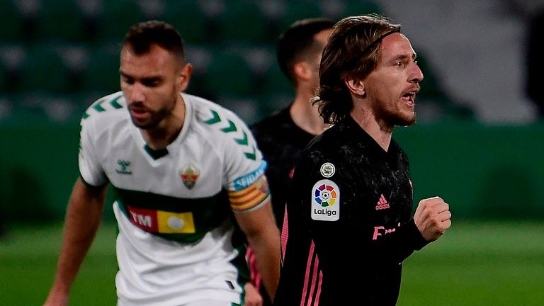 Luka Modric celebrates his goal against Elche as Real were held to a 1-1 draw