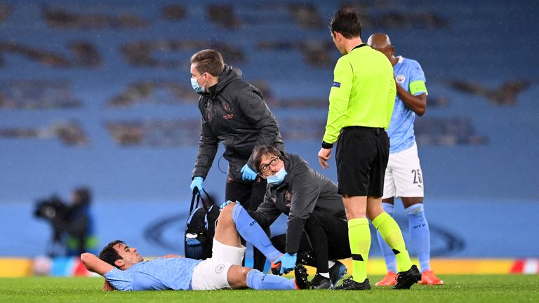 MANCHESTER, ENGLAND - DECEMBER 09: Eric Garcia of Manchester City receives medical treatment during the UEFA Champions League Group C stage match between Manchester City and Olympique de Marseille at Etihad Stadium on December 09, 2020 in Manchester, England. The match will be played without fans, behind closed doors as a Covid-19 precaution. (Photo by Laurence Griffiths/Getty Images)