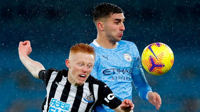 Newcastle United midfielder Matty Longstaff and Manchester City's Ferran Torres compete for the ball