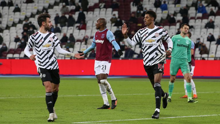 Manchester United's Marcus Rashford celebrates his third goal during a Premier League match between West Ham United and Manchester United at the London Stadium on December 5, 2020 in England.  A limited number of fans are welcomed back to the stadiums to watch England's elite football. 