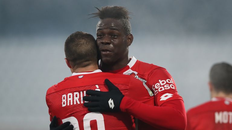 Mario Balotelli celebrates after his goal just four minutes into his debut