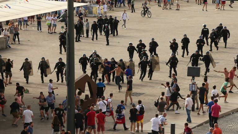 French riot police move in to arrest Russian fans after violence broke out between supporters ahead of the England vs Russia Euro 2016 match in Marseille, France.