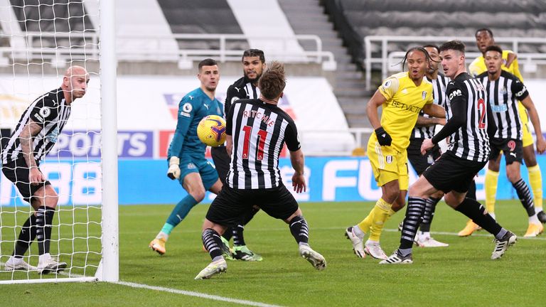 Newcastle United's Matt Ritchie scores an own goal against Fulham