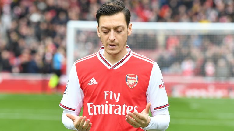Arsenal&#39;s Mesut Ozil prays beforemeut the Premier League match between Arsenal FC and West Ham United at Emirates Stadium on March 07, 2020 in London, United Kingdom