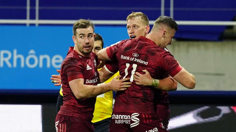 Munster players celebrate with Mike Haley after his try against Clermont
