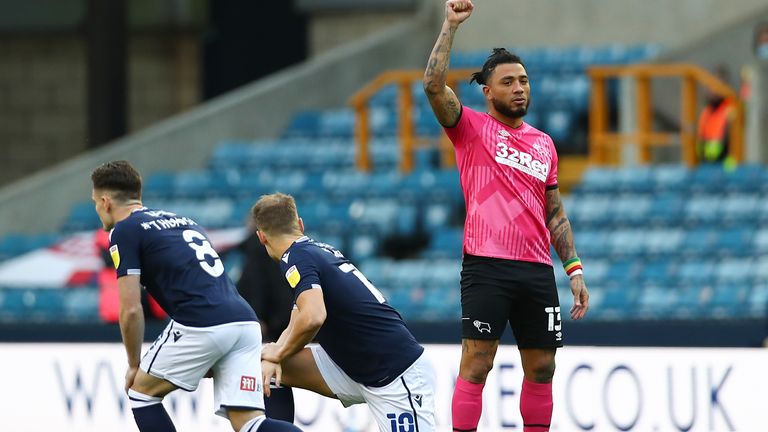 Millwall players knelt at the start of their match against Derby 