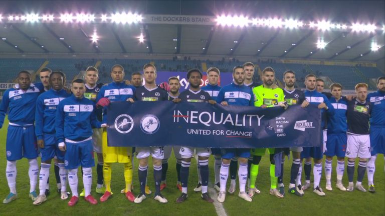 Millwall and QPR players hold up a United For Change banner
