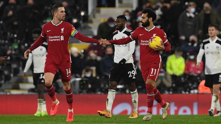 Mohamed Salah celebrates with Jordan Henderson after scoring the equaliser