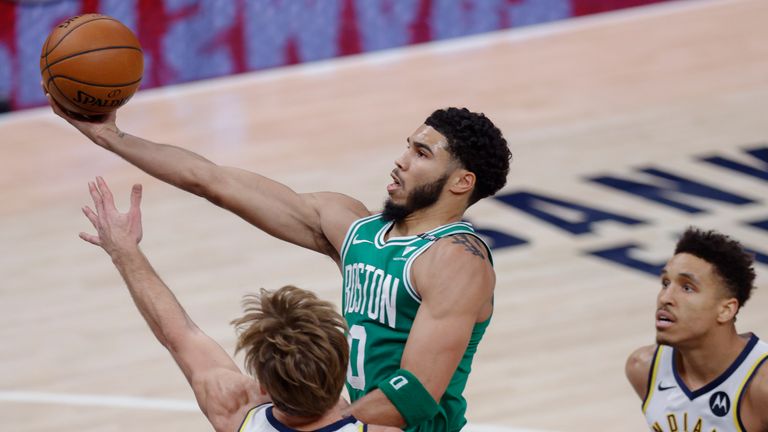 Jayson Tatum #0 of the Boston Celtics shoots the ball against Domantas Sabonis #11 of the Indiana Pacers during the first half at Bankers Life Fieldhouse on December 29, 2020 in Indianapolis, Indiana. 