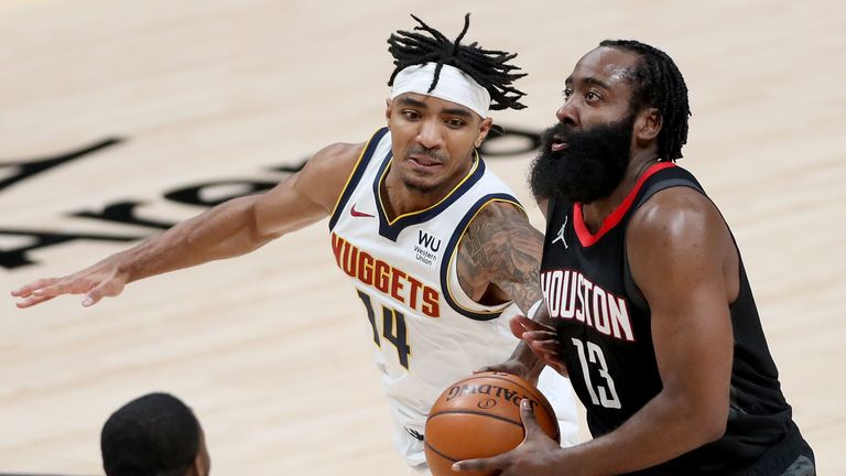James Harden #13 of the Houston Rockets drives to the basket against Gary Harris #14 of the Denver Nuggets in the third quarter at Ball Arena on December 28, 2020 in Denver, Colorado.