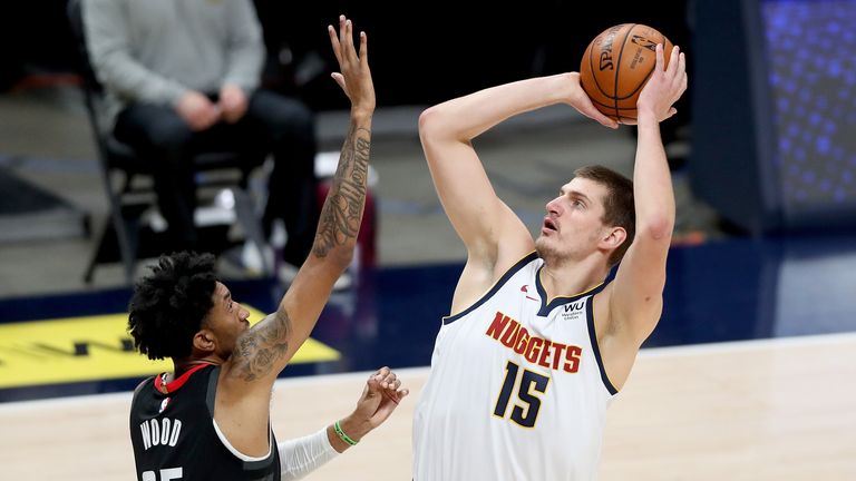 Nikola Jokic #15 of the Denver Nuggets puts up a shot over Christian Wood #35 of the Houston Rockets in the first quarter at Ball Arena on December 28, 2020 in Denver, Colorado