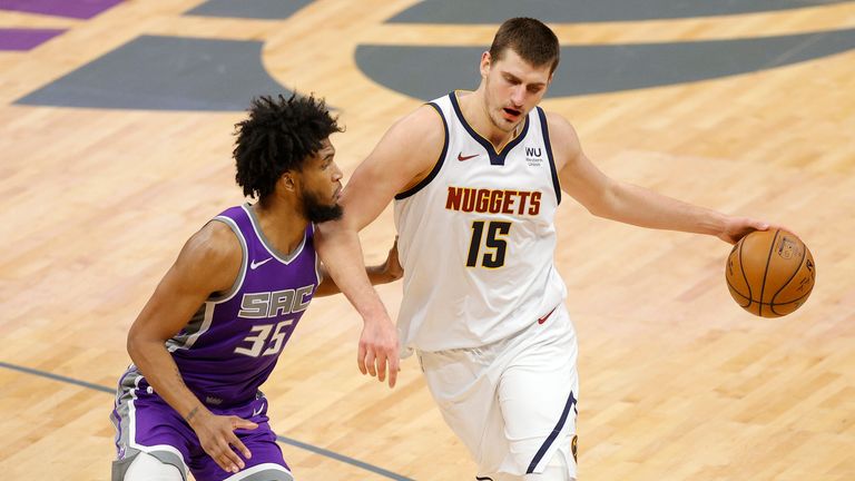 Nikola Jokic #15 of the Denver Nuggets is guarded by Marvin Bagley III #35 of the Sacramento Kings at Golden 1 Center on December 29, 2020 in Sacramento, California. 