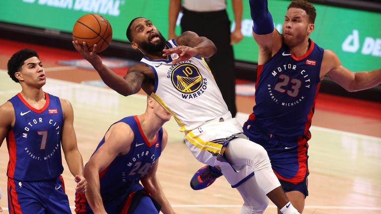 Brad Wanamaker #10 of the Golden State Warriors tries to get a shot off next to Blake Griffin #23 of the Detroit Pistons during the first half at Little Caesars Arena on December 29, 2020 in Detroit, Michigan.