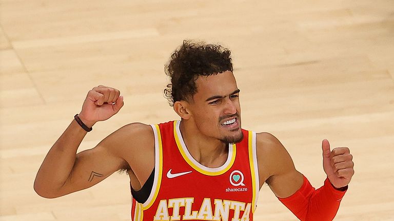  Trae Young #11 of the Atlanta Hawks reacts during the first half against the Detroit Pistons at State Farm Arena on December 28, 2020 in Atlanta, Georgia. 