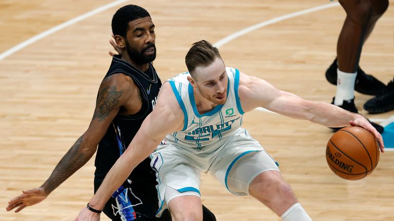 Gordon Hayward #20 of the Charlotte Hornets is guarded by Kyrie Irving #11 of the Brooklyn Nets during the fourth quarter of their game at Spectrum Center