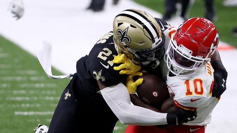Malcolm Jenkins #27 of the New Orleans Saints tackles Tyreek Hill #10 of the Kansas City Chiefs in the game at Mercedes-Benz Superdome on December 20, 2020 in New Orleans, Louisiana. 