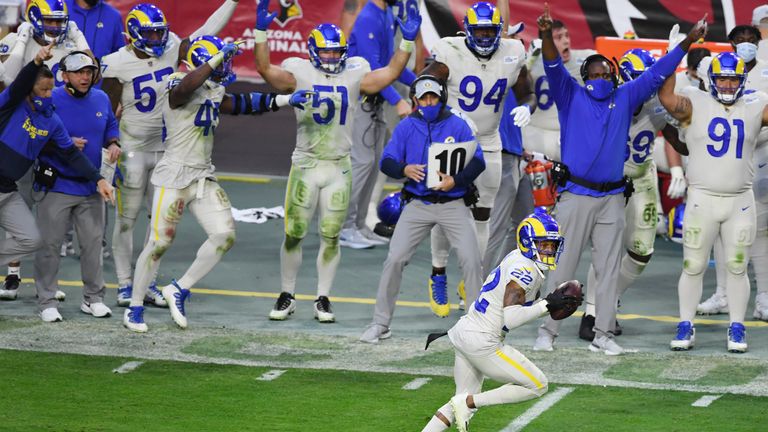 Cornerback Troy Hill #22 of the Los Angeles Rams scores a touchdown on an interception return during the second half against the Arizona Cardinals at State Farm Stadium on December 06, 2020 in Glendale, Arizona.