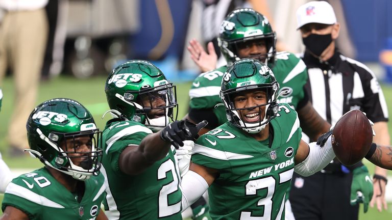 Bryce Hall #37 of the New York Jets celebrates with teammates following an interception during the second quarter of a game against the Los Angeles Rams at SoFi Stadium on December 20, 2020 in Inglewood, California.