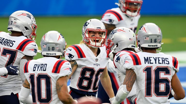 Wide receiver Gunner Olszewski #80 of the New England Patriots celebrates with teammates after Olszewski scored a touchdown on a punt return in the second quarter of the game against the Los Angeles Chargers at SoFi Stadium on December 06, 2020 in Inglewood, California.