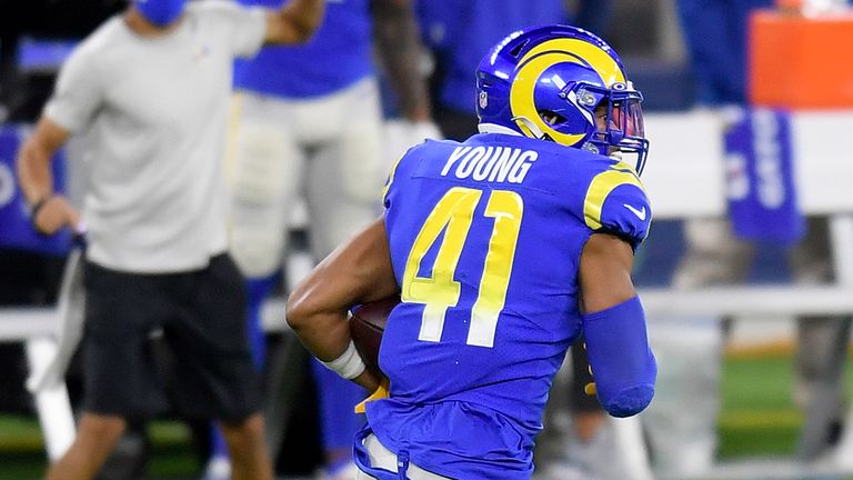 Kenny Young #41 of the Los Angeles Rams runs for a touchdown after an interception during the second quarter in the game against the New England Patriots at SoFi Stadium on December 10, 2020 in Inglewood, California. 