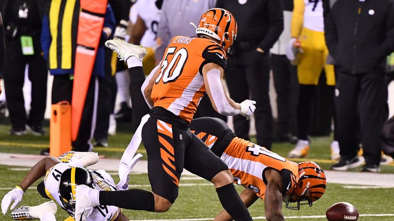 Vonn Bell #24 of the Cincinnati Bengals forces a fumble by JuJu Smith-Schuster #19 of the Pittsburgh Steelers during the first quarter at Paul Brown Stadium on December 21, 2020 in Cincinnati, Ohio. 