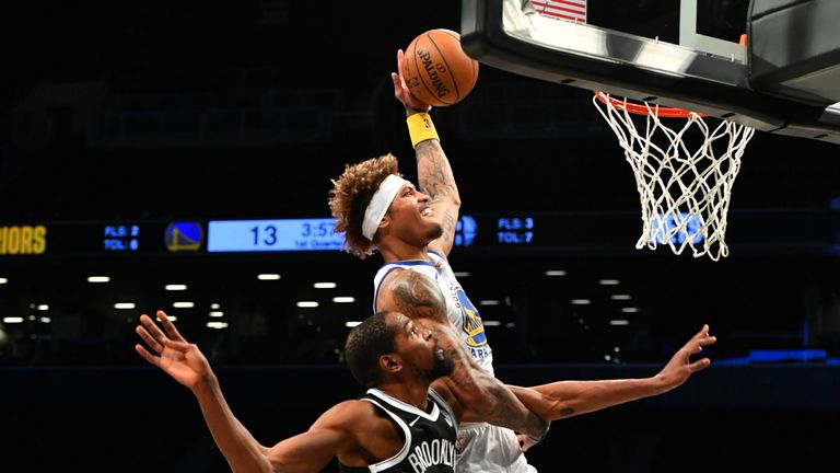 Kelly Oubre Jr. #12 of the Golden State Warriors dunks the ball during the game against Kevin Durant #7 of the Brooklyn Nets on December 22, 2020 
