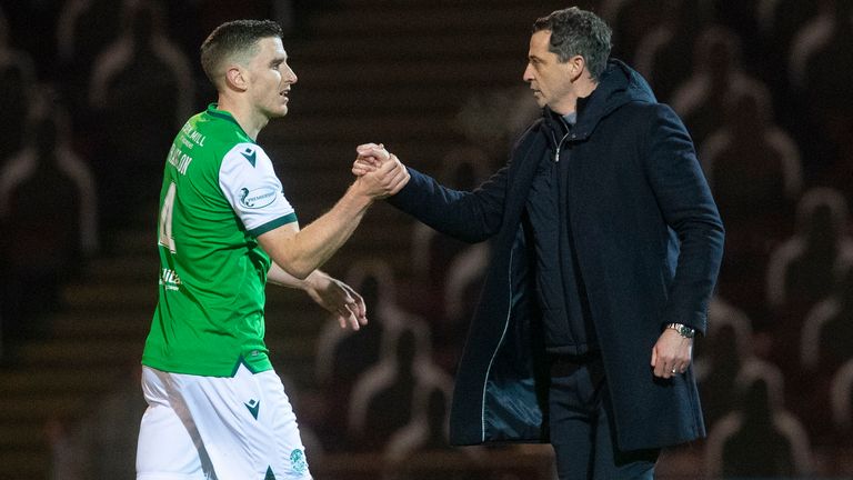 Hibs' Paul Hanlon (L) and manager Jack Ross celebrate at full time