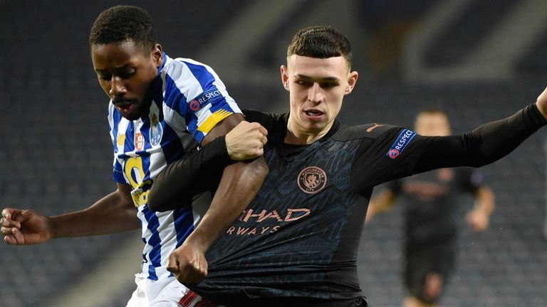 Phil Foden tangles with Porto's Wilson Manafa