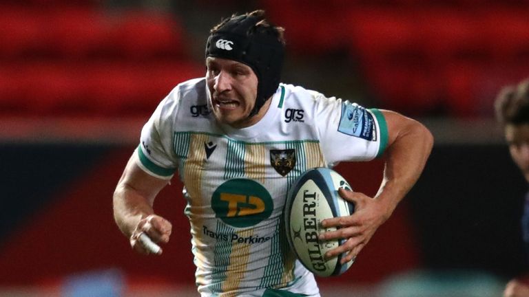 BRISTOL, ENGLAND - DECEMBER 04: Piers Francis of Northampton Saints escapes the tackle from Bryan Byrne of Bristol Bears during the Gallagher Premiership Rugby match between Bristol and Northampton Saints at Ashton Gate on December 04, 2020 in Bristol, England. (Photo by Michael Steele/Getty Images)