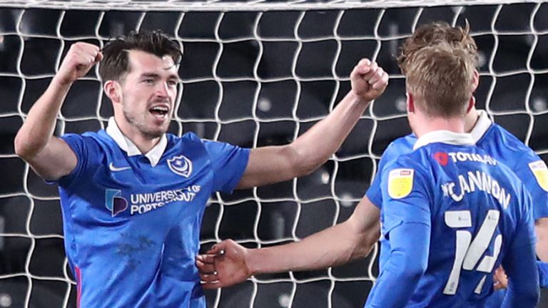 Portsmouth moved top of League One after a 2-0 win over Hull at the KCOM Stadium