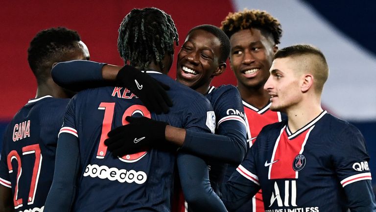 Moise Kean (2L) celebrates with team-mates after scoring
