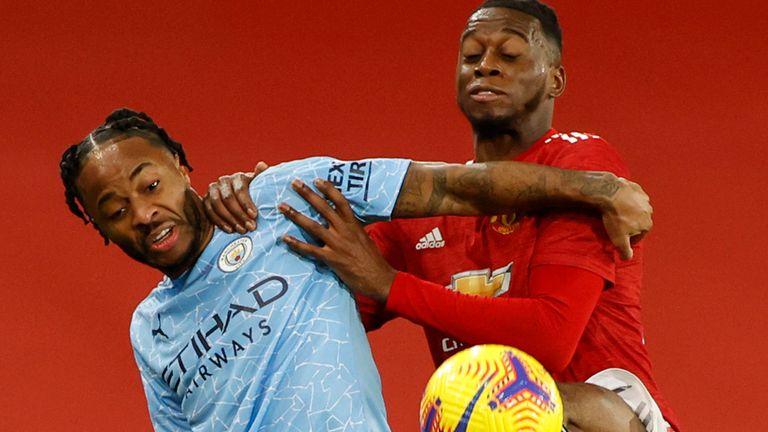 Raheem Sterling and Aaron Wan-Bissaka battle for the ball at Old Trafford